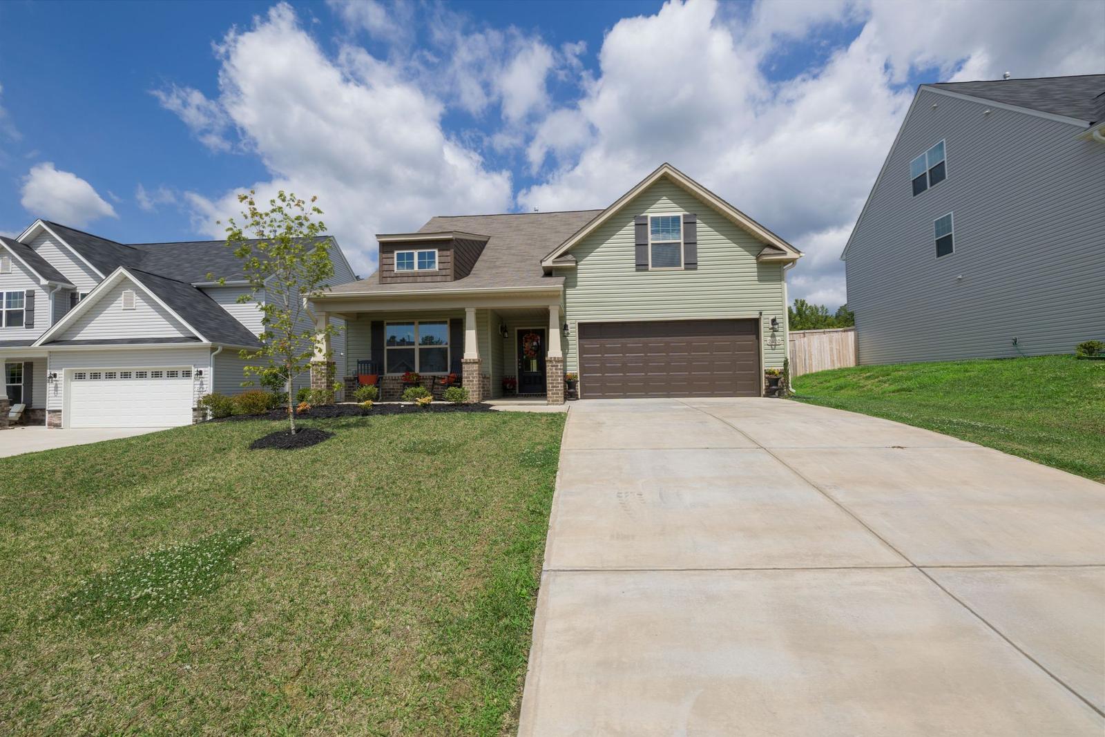 A well-kept detached home with a clean driveway
